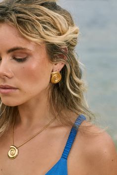 The beautiful Dune set includes a pendant necklace and matching earrings, both in the shape of a beautiful Ammonite shell, all handmade in Sydney from 18k gold fill. That's right, it's fancy AND unique. This set is perfect for all your beach and resort adventures because it's waterproof and tarnish resistant. No need to worry about your jewellery getting ruined while you're living your best life. The necklace is 42cm long with an extender. So whether you're lounging by the pool or dancing the night away, this set has got you covered. Ammonite Shell, The Dunes, Shell Pendant, Matching Earrings, Chain Lengths, Life Is Good, Gold Filled, Sydney, Dancing