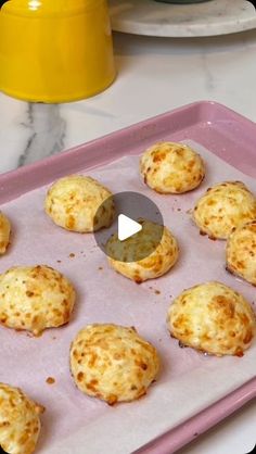 some food that is sitting on a pink tray in the middle of a counter top