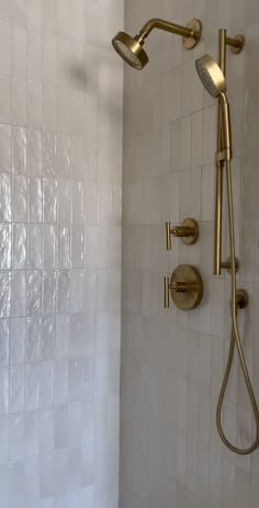 the shower head and handset are gold in color