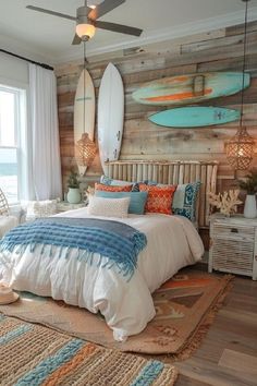 a bedroom with wooden walls and surfboards on the wall above the bed, along with an area rug