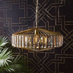 a golden chandelier hanging from a ceiling