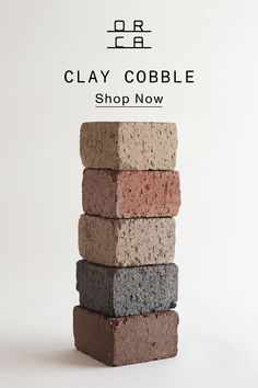 a stack of clay cobbles sitting on top of each other in front of a white background