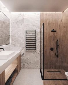 a modern bathroom with marble walls and floor