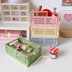 three plastic containers filled with food on top of a white table next to other toys