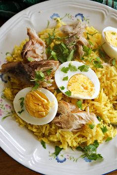 an egg and rice dish on a white plate