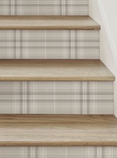 the stairs are lined with plaid carpet