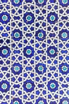 an intricate blue and white tile pattern on the side of a building in tunis, morocco