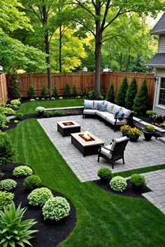 an outdoor patio with seating and landscaping in the back yard, surrounded by green grass