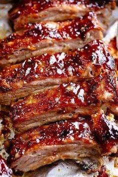 slices of ribs covered in bbq sauce