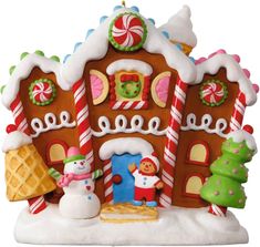 a gingerbread house is decorated with candy canes and candies for the holiday season