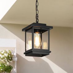 an outdoor light hanging from the ceiling