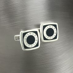 Bulgari Bvlgari Estate Onyx Cufflinks Silver B7TRUSTED SELLER SINCE 2002PLEASE SEE OUR HUNDREDS OF POSITIVE FEEDBACKS FROM OUR CLIENTS!!FREE SHIPPINGDETAILSMaterial: Onyx and Sterling SilverWeight: 18 Grams Introducing the quintessence of luxury and design - the authentic Bulgari Bvlgari sterling silver cufflinks. These exquisite cufflinks are a testament to Bulgari’s renowned craftsmanship and timeless elegance. Crafted from premium sterling silver, they feature the iconic Bulgari Bvlgari logo, Luxury Sterling Silver Business Jewelry, Luxury Sterling Silver Jewelry For Business, Designer Silver Cufflinks With Polished Finish, Silver Designer Cufflinks For Business, Luxury Sterling Silver Cufflinks For Business, Luxury Sterling Silver Cufflinks, Luxury Black Cufflinks For Formal Occasions, Black Luxury Cufflinks For Formal Occasions, Black Luxury Cufflinks For Formal Wear