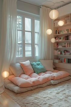 a living room filled with lots of furniture and bookshelves next to a window