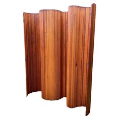 a wooden room divider is shown with three sections in the same color and width