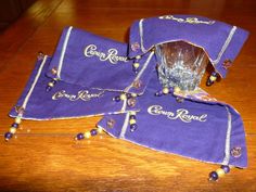 "Beverage Cover Ups, Crown Royal, Purple, Gold.  Hand washable.  Each one has Crown Royal on it. This is an original bag Handmade by Material Visions on Etsy. These are made from the Crown Royal bags Throw one over any beverage to keep blows in out of your beverage!  Beverage Cover Ups are weighted in each of the corners with beads.    Great for any party, BBQ and good conversation. Take along when you travel or go out to lunch. Use as Coasters. Hand wash and lay flat to dry This set will be mai Crown Royal Crafts, Crown Royal Drinks, Crown Royal Quilt, Crown Royal Bottle, Crown Royal Bags, Drink Covers, Repurposed Clothing, Out To Lunch, Man Party