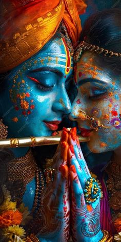 two people painted in blue and orange are kissing