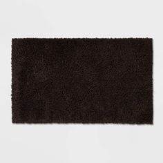 a dark brown rug on a white background