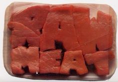 raw meat cut up into small pieces in a plastic container with the words raw on it