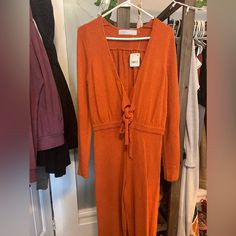 Brand New With Tags. :) Never Worn. Long Sleeve Jumpsuit With Tie Waist For Day Out, Summer Long Sleeve Jumpsuits For Day Out, Casual Beach Season Jumpsuits And Rompers With Tie Waist, Chic Jumpsuits And Rompers For Fall Brunch, Summer Fitted Jumpsuits And Rompers With Tie Waist, Long Sleeve Jumpsuits And Rompers For Fall Vacation, Fitted Summer Jumpsuits And Rompers With Tie Waist, V-neck Jumpsuits And Rompers For Fall Brunch, Chic One-piece Jumpsuits And Rompers For Loungewear