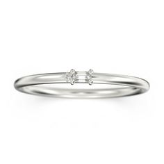 a white gold ring with two diamonds on it