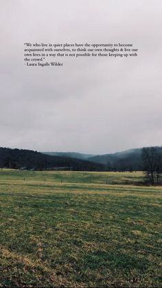 a large open field with trees in the distance and a quote written on it that says, we live in places that opportunity to become