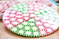 two colorful plates sitting on top of a wooden table