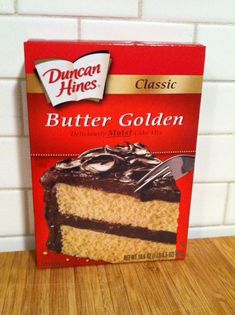 a box of butter golden cake sitting on top of a wooden table