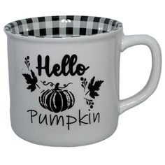 a white and black coffee mug with the words hello pumpkin printed on it