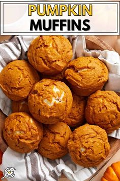 pumpkin muffins in a wooden bowl on top of a striped towel with text overlay