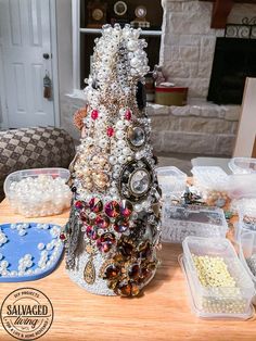 a christmas tree made out of jewelry on a table