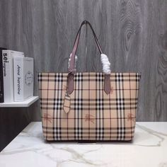 SHOP MORE LUXURY PRODUCTS HERE Description Burberry Reversible Tote Haymarket Canvas Medium For Women, Women’s Bags 19.3in/49cm Size : 28 x 14 x 49 cm / 11 x 5.6 x 19.3 inches (Length x height x width) Designed for everyday practicality, Burberry’s brown TB bag is made in Italy from checked canvas and shaped to a generous frame for all your essentials. Light purple handlesDiscoloration and peeling on base cornersLoss of shape on handlesWear on opening edgesCracking on handle base wax Dior Shirt, Louis Vuitton Shirt, Chanel Shirt, Reversible Tote, Gucci Gg Marmont, Reversible Belt, Luxury Products, Burberry Handbags, Burberry Bag