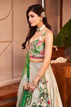 Mint green lehenga with sequins, crystals, mirror, cutdana and tassels embroidered flora and fauna motifs. Paired with coordinating lace embroidered blouse and tasselled dupatta. - Aza Fashions Festive Green Dress With Unstitched Blouse, Designer Green Choli With Intricate Embroidery, Green Floor-length Set With Floral Embroidery, Green Floor-length Sets With Floral Embroidery, Green Floral Embroidery Floor-length Dress Set, Green Floral Embroidery Floor-length Sets, Designer Green Embroidered Lehenga, Designer Green Lehenga With Floral Embroidery, Unstitched Green Embroidered Lehenga