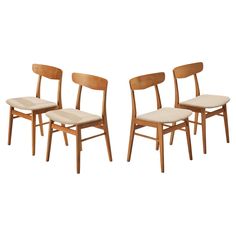 two wooden chairs sitting next to each other