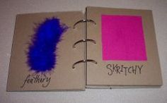 two notebooks with blue and pink ink on them, one has a notepad in the middle