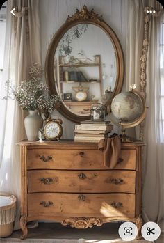 an old dresser with a mirror and clock on it's top shelf next to a window