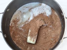 a pot filled with some kind of chocolate and white substance in the middle of it