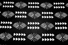 a black and white pattern with arrows on it