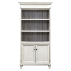 a white bookcase with two doors and drawers