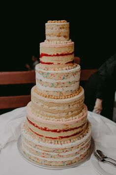 a multi layer cake sitting on top of a table