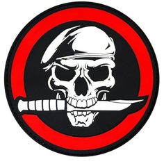 a skull with a knife in it's mouth on a black and red patch