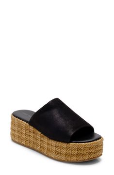 A woven raffia platform enhances the earthy vibes of this breezy and versatile sandal. 1 1/2" heel; 1" platform Synthetic upper/leather lining/synthetic sole Imported Comfortable Straw Platform Wedge Sandals, Straw Sandals With Textured Sole And Round Toe, Comfortable Straw Sandals With Woven Sole, Comfortable Sandals With Woven Straw Sole, Synthetic Espadrilles With Textured Sole For Vacation, Natural Color Synthetic Wedge Sandals With Woven Sole, Natural Wedge Heel Sandals With Textured Sole, Natural Color Wedge Heel Sandals With Textured Sole, Leather Wedge Sandals With Woven Sole For Vacation