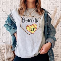 Show support for your favorite Softball player or Softball team with this Softball Grandma or Softball Aunt Shirt!  Find all your Softball shirts and gifts here! https://www.etsy.com/shop/JaxGraphicTees?ref=seller-platform-mcnav&search_query=softball All of our adult t-shirts are Bella + Canvas 3001 Unisex shirts. They are a super soft fabric that will quickly become a go to in your wardrobe. Its lightweight and flexible material is perfect for casual wear or any activity. Sizing details: * All Baseball Season Shirt With Sublimation Print, Sports Shirt With Team Name For Baseball Season, Team Spirit Shirt With Sublimation Print For Baseball Season, Baseball Season Team Shirt Fan Apparel, Baseball Season Fan Apparel Shirt With Team Name, Varsity T-shirt For Baseball Season Team Events, Baseball Season Team Name Fan Gear Shirt, Baseball Season T-shirt With Heat Transfer Vinyl, Sports Fan T-shirt For Baseball Season Team Events