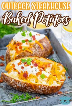 two baked potatoes with cheese and bacon on them