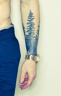 a person with a tree tattoo on their arm and hand, holding onto the other arm