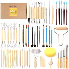 an assortment of kitchen utensils and tools displayed in front of a cardboard box