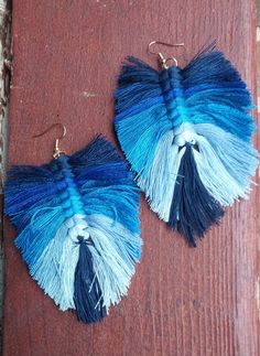 Cute handcrafted Yarn feather Earrings  Pictured as Shown  Very lightweight 2 inch drop 2 .5 inch width Cute one of a kind! Blue Fringe Earrings For Festivals, Blue Bohemian Earrings With Fringe, Bohemian Blue Earrings With Fringe, Adjustable Blue Feather Earrings, Handmade Blue Bohemian Tassel Earrings, Bohemian Blue Handmade Tassel Earrings, Blue Macrame Dangle Earrings, Blue Feather Earrings As Gift, Blue Feather Earrings Gift