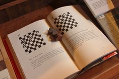 an open book sitting on top of a wooden table