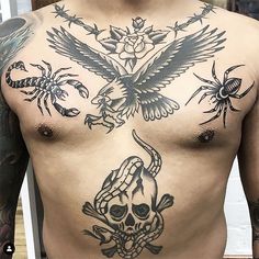 a man with tattoos on his chest has a bird and skull tattoo on his chest