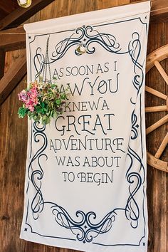 a sign with flowers on it that says, as soon as you knew a great adventure was about to begin