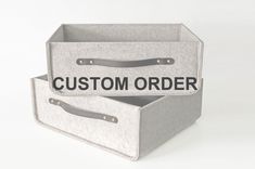 two canvas storage bins with the words custom order printed on one side and bottom